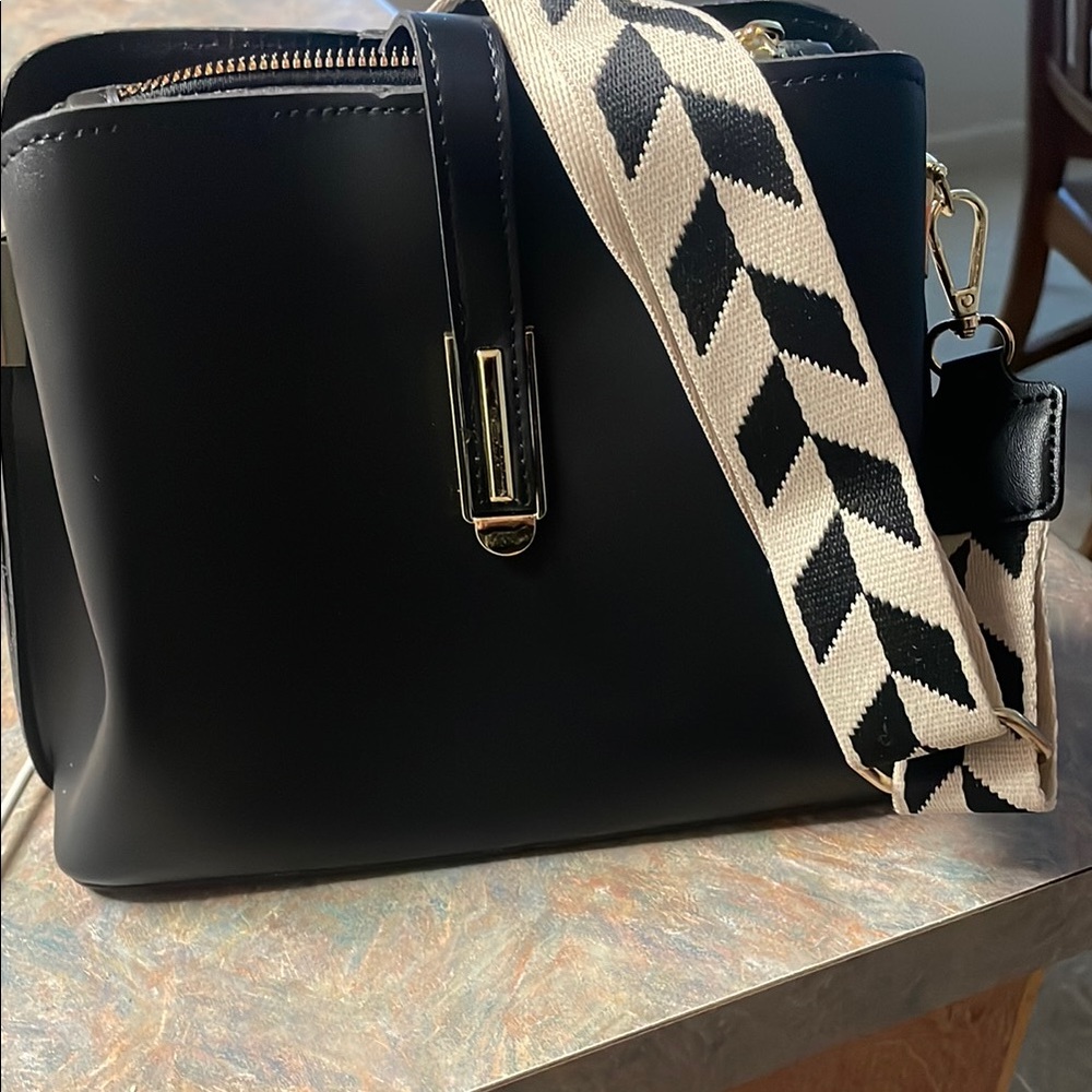 Stylish Black Handbag with Patterned Strap